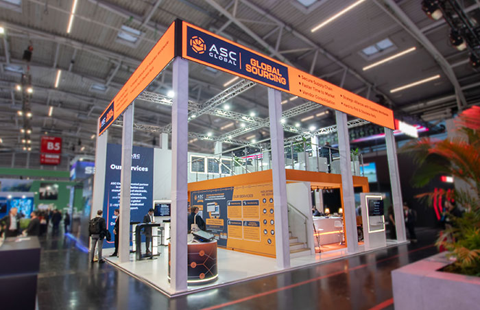 Image of ASC Global's two-story booth displayed at the Electronica 2024 trade show, featuring a modern design showcasing their services and capabilities in the electronic components industry