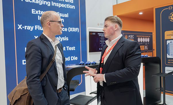 Image of an ASC Global representative engaging with visitors, explaining the company's benefits and solutions, and highlighting expertise in the electronic components industry