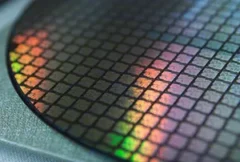 Illustration of an advanced semiconductor fabrication facility producing next-generation 2nm chips, featuring silicon wafers, cleanroom manufacturing equipment, and AI-driven computing infrastructure. The image represents TSMC's fully booked 2nm production capacity, highlighting strong demand from AI, mobile, and cloud computing markets, advanced semiconductor manufacturing, leading-edge process technologies, and growing pressure on chip packaging and supply chain capacity.