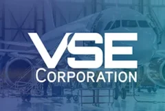 Illustration of an aviation maintenance and repair facility featuring aircraft components, technicians, logistics operations, and MRO service equipment. The image represents VSE Corporation's acquisition of Precision Aviation Group, highlighting expanded aviation aftermarket services, aircraft parts distribution, repair capabilities, global MRO networks, and enhanced support for commercial and defense aerospace maintenance operations.